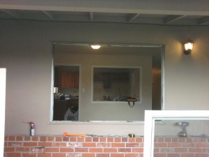 Old aluminum single pane window being replaced with new retrofit vinyl window. Job was in Pittsburg